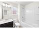 Bright bathroom featuring a shower-tub combo and vanity with a single sink, well-lit and modern at 17413 Caddy Ct, Charlotte, NC 28278