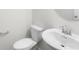 A powder room features a toilet and vanity with a light faucet and chrome accents at 17413 Caddy Ct, Charlotte, NC 28278