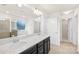 Primary bathroom featuring dual sinks, lots of counterspace, and large mirror and light fixture at 17413 Caddy Ct, Charlotte, NC 28278