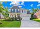 Charming two-story home with a well-manicured lawn, inviting front porch, and a two-car garage at 17413 Caddy Ct, Charlotte, NC 28278