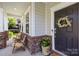 Inviting front porch with cozy seating and stylish decor, creating a warm and welcoming entrance at 17413 Caddy Ct, Charlotte, NC 28278