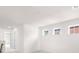 Upstairs hallway with neutral carpet, white walls and ceilings, and multiple windows at 17413 Caddy Ct, Charlotte, NC 28278