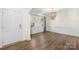 Bright living room featuring hardwood floors, elegant lighting, and a welcoming ambiance at 17413 Caddy Ct, Charlotte, NC 28278