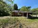 Inviting brick exterior with an attached carport, presenting an opportunity for renovation and customization at 191 S Main St, Richburg, SC 29729