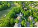 Aerial view of a neighborhood near the golf course featuring beautiful homes with swimming pools at 200 Royalton Pl, Huntersville, NC 28078