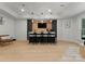 Spacious basement featuring a bar area, modern lighting, and a lounge area at 200 Royalton Pl, Huntersville, NC 28078