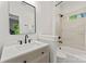 Bright bathroom featuring a large mirror, tile flooring, and tub-shower combo at 200 Royalton Pl, Huntersville, NC 28078