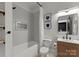 Updated bathroom featuring shower-tub combination, modern vanity, and stylish fixtures at 200 Royalton Pl, Huntersville, NC 28078