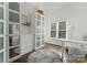 Bright bedroom featuring built in shelves, and large windows at 200 Royalton Pl, Huntersville, NC 28078