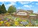 Welcome to Skybrook, a beautiful community with colorful flowers and stone entrance at 200 Royalton Pl, Huntersville, NC 28078