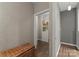Hallway featuring hardwood floors, a wicker bench and an open door at 200 Royalton Pl, Huntersville, NC 28078