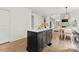 Open kitchen with island and pendant lighting adjacent to breakfast nook at 200 Royalton Pl, Huntersville, NC 28078