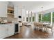 Open concept living area offers seamless transition from bar to dining area, with natural light at 200 Royalton Pl, Huntersville, NC 28078