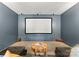 Home theater room featuring a large screen, projector, and comfortable seating at 200 Royalton Pl, Huntersville, NC 28078