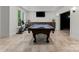 Entertainment room featuring a pool table, TV, exercise equipment, and a built-in bar at 200 Royalton Pl, Huntersville, NC 28078