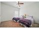 Charming bedroom featuring neutral walls, carpet, ceiling fan and two beds, offering a serene retreat at 212 Kilborne Rd, Mooresville, NC 28117
