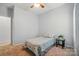 Neutral bedroom featuring neutral walls, carpet, ceiling fan and a single bed by a window, offering a serene retreat at 212 Kilborne Rd, Mooresville, NC 28117
