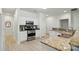 Well-lit kitchen with granite countertops, modern appliances, and sleek white cabinetry at 212 Kilborne Rd, Mooresville, NC 28117