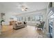 Open-concept living space with lots of natural light, seamlessly connecting the living, dining, and kitchen areas at 212 Kilborne Rd, Mooresville, NC 28117
