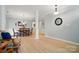 Open-concept living and dining area with hardwood floors and neutral paint at 212 Kilborne Rd, Mooresville, NC 28117