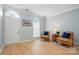 Bright living room featuring hardwood floors, a decorative window, and comfortable seating at 212 Kilborne Rd, Mooresville, NC 28117