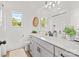 Bright bathroom with a double vanity, quartz countertop, and modern fixtures at 215 Scout Rd, Locust, NC 28097