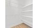 This walk-in closet features wire shelving, wood-look floors, and ample storage space at 215 Scout Rd, Locust, NC 28097