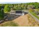 A home exterior displaying its well-maintained yard and classic architectural details at 215 Scout Rd, Locust, NC 28097