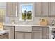 Charming kitchen features a farmhouse sink, stainless steel appliances, and modern cabinets at 215 Scout Rd, Locust, NC 28097