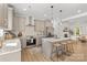This spacious open kitchen includes an island with seating and pendant lights, stainless steel appliances, and ample cabinets at 215 Scout Rd, Locust, NC 28097