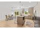 Spacious kitchen island with modern appliances and dining area, perfect for entertaining at 215 Scout Rd, Locust, NC 28097