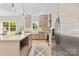 Modern kitchen features stainless steel appliances, white countertops, and neutral colored cabinets at 215 Scout Rd, Locust, NC 28097
