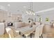 Dining room and kitchen with a combination of natural light and drop down lights at 215 Scout Rd, Locust, NC 28097