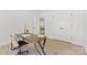 Bright office features a wood desk with decor and a view into the living room at 215 Scout Rd, Locust, NC 28097