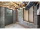 Unfinished basement area with door to outside at 221 Palmer St, Albemarle, NC 28001