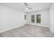 Bright bedroom with hardwood flooring, a ceiling fan and a door to the outside at 221 Palmer St, Albemarle, NC 28001