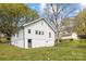Charming white home features a basement garage and lovely backyard at 221 Palmer St, Albemarle, NC 28001