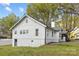 Charming white home features a basement garage and lovely backyard at 221 Palmer St, Albemarle, NC 28001