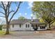 Charming white home features a lovely backyard at 221 Palmer St, Albemarle, NC 28001