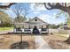 Beautifully renovated white house with black accents, porch and manicured yard on a sunny day at 221 Palmer St, Albemarle, NC 28001
