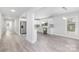 Modern, white kitchen with stainless steel appliances and light grey backsplash and flooring at 221 Palmer St, Albemarle, NC 28001