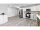 Well-lit kitchen featuring stainless steel appliances, grey tile backsplash, and ample cabinet space at 221 Palmer St, Albemarle, NC 28001