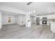Open floor plan with modern, white kitchen and bright living room with natural light at 221 Palmer St, Albemarle, NC 28001