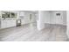 Open-concept living space showcasing new floors, fresh white paint, and abundant natural light at 221 Palmer St, Albemarle, NC 28001