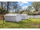 The backyard includes two storage units and a lovely lawn at 221 Palmer St, Albemarle, NC 28001