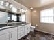 Elegant bathroom featuring a double vanity with marble countertops and modern fixtures at 2316 Highland Park Dr, Charlotte, NC 28269