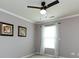Cozy bedroom with neutral walls, white trim, and a bright window at 2316 Highland Park Dr, Charlotte, NC 28269