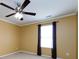 Comfortable bedroom with neutral walls, ceiling fan and carpet at 2316 Highland Park Dr, Charlotte, NC 28269