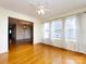 Bonus room featuring hardwood floors with a view into another living space at 2316 Highland Park Dr, Charlotte, NC 28269