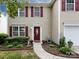 Attractive two-story home with red shutters, a red door, and landscaped front yard at 2316 Highland Park Dr, Charlotte, NC 28269